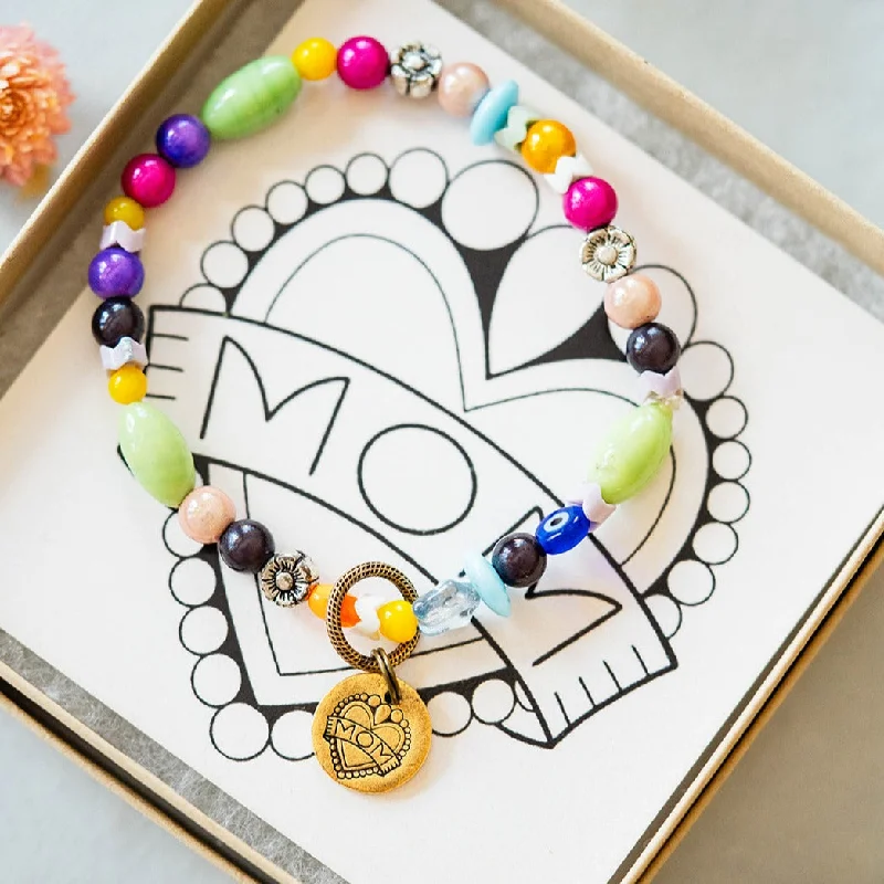 trendy charm bracelets -"Mom" Bracelet Featuring Katie Tattoos and Heifer International