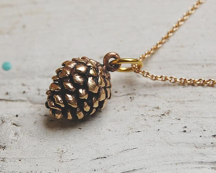 trendy necklaces for women -'pine cone' necklace | bronze