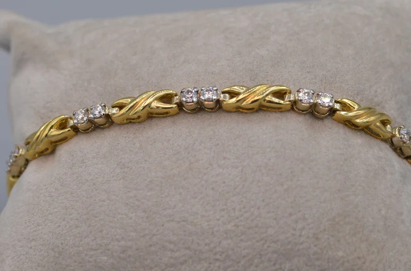 trendy leather bracelets -14K yellow gold and diamond bracelet - Hugs & Kisses design